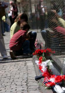 Children placing flowers at Vietman War Memorial
